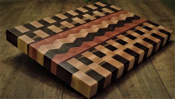 Maple and walnut basket weave cutting board with Cherry, maple and walnut chevron center accent. Made in Canada by Bergeron Woodgrains