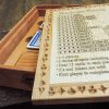 Handcrafted wooden board game featuring a Frustration Rummy scorecard with storage box with metal peg storage and Bicycle playing cards displayed. Made by Bergeron Woodgrains