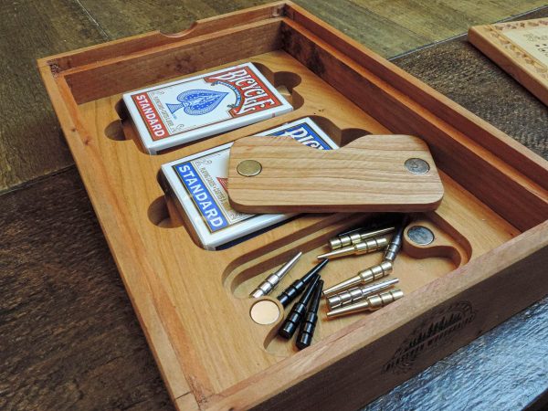 Handcrafted wooden board game featuring a Frustration Rummy scorecard with storage box with metal peg storage and Bicycle playing cards displayed. Made by Bergeron Woodgrains