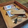 Handcrafted wooden board game featuring a Frustration Rummy scorecard with storage box with metal peg storage and Bicycle playing cards displayed. Made by Bergeron Woodgrains