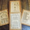 Handcrafted wooden board game showcasing a variety of scorecards layed out on a harvest table. Canadian-made by Bergeron Woodgrains