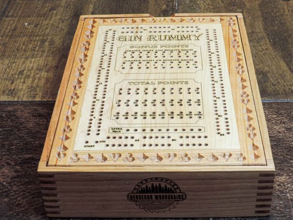 Handcrafted wooden board game featuring a Frustration Rummy and Gin Rummy double sided scorecard with storage box showcasing dovetail and box finger joints. Made by Bergeron Woodgrains