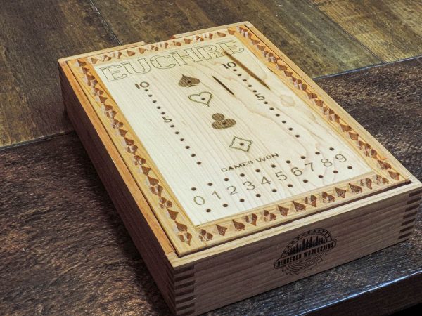 Handcrafted wooden board game featuring a Euchre scorecard with peg and playing card storage box showcasing dovetail and box finger joints. Made by Bergeron Woodgrains