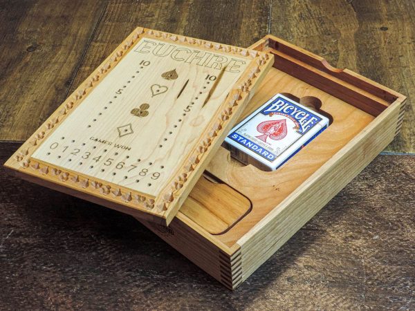 Handcrafted wooden board game featuring a Euchre scorecard with peg and playing card storage box showcasing dovetail and box finger joints. Made by Bergeron Woodgrains