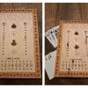 Handcrafted wooden board game featuring a Euchre scorecard with storage box with metal peg storage and Bicycle playing cards displayed. Made by Bergeron Woodgrains