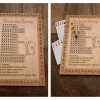 Handcrafted wooden board game featuring a Frustration Rummy scorecard with storage box displaying pegs and Bicycle playing cards in play. Made by Bergeron Woodgrains