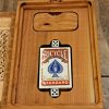 Handcrafted wooden board game featuring a Serpents and Ladders scorecard with storage box with peg storage and Bicycle playing cards displayed. Played similar to Snakes and Ladders. Made by Bergeron Woodgrains