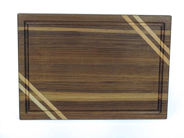 Walnut edge grain cutting board with two Maple accent strips along 2 opposing corners featuring a juice groove. Made in Canada by Bergeron Woodgrains