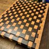 Maple and walnut checkered basket weave end grain cutting board butcher block measuring 18”x24’x1.5”. Showcasing juice groove and handles. Canadian made by Bergeron Woodgrains