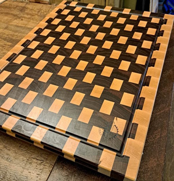 Maple and walnut checkered basket weave end grain cutting board butcher block measuring 18”x24’x1.5”. Showcasing juice groove and handles. Canadian made by Bergeron Woodgrains