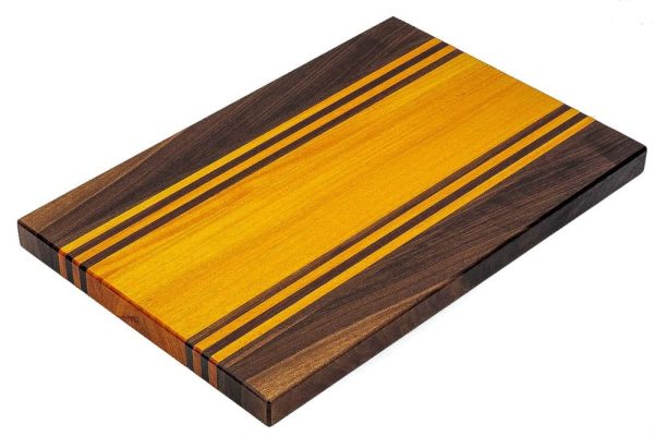 Walnut and Osage Orange edge grain cutting board with walnut and osage orange accent strips. Made in Canada by Bergeron Woodgrains