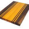 Walnut and Osage Orange edge grain cutting board with walnut and osage orange accent strips showcasing handles. Made in Canada by Bergeron Woodgrains