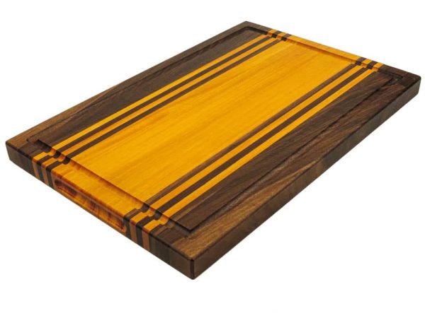 Walnut and Osage Orange edge grain cutting board with walnut and osage orange accent strips showcasing juice groove and handles. Made in Canada by Bergeron Woodgrains