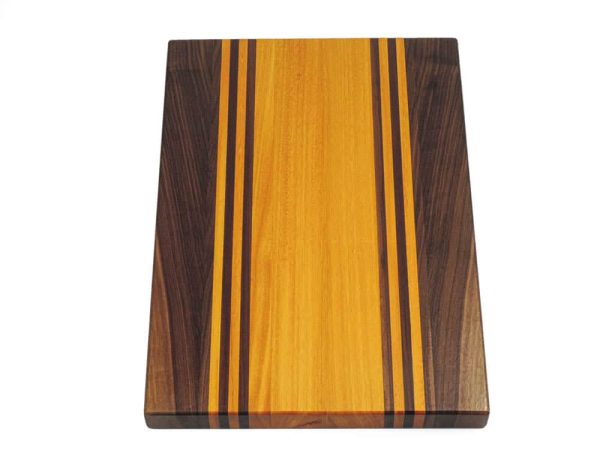 Walnut and Osage Orange edge grain cutting board with walnut and osage orange accent strips. Made in Canada by Bergeron Woodgrains