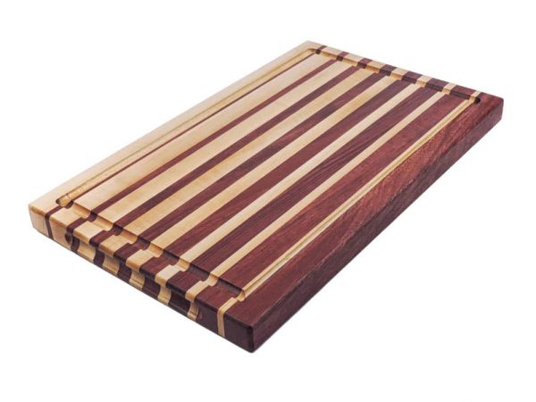 Maple and purple heart edge grain cutting board featuring narrowing opposing strips running along the long edge of the cutting board with juice groove and handles. Canadian made by Bergeron Woodgrains