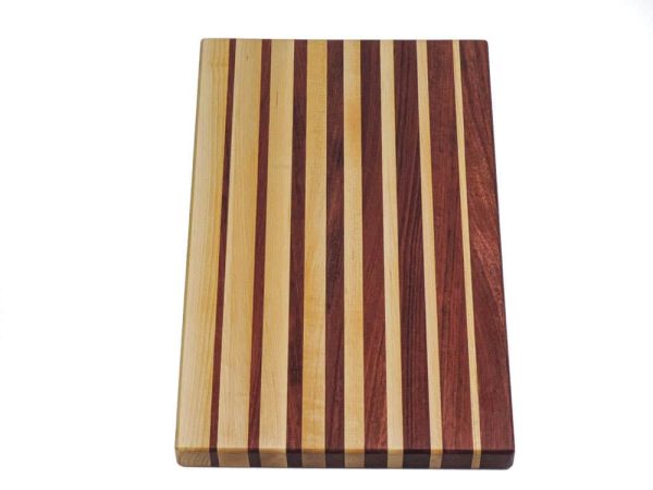 Maple and purple heart edge grain cutting board featuring narrowing opposing strips running along the long edge of the cutting board. Canadian made by Bergeron Woodgrains