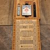 Handcrafted wooden board game featuring a Rummy 500 scorecard with storage box with pegs, cards, bingo chips and dice displayed. Made by Bergeron Woodgrains