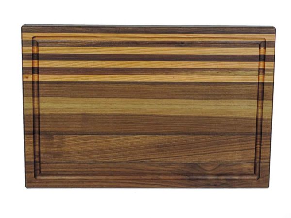 Walnut edge grain cutting board with 4 cherry stripes, featuring a juice groove along the top of the board. Canadian made by Bergeron Woodgrains