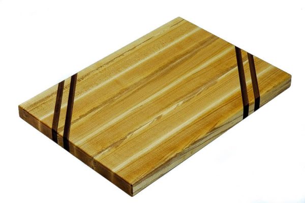 Maple edge grain cutting board with two walnut accent strips along 2 opposing corners. Made in Canada by Bergeron Woodgrains