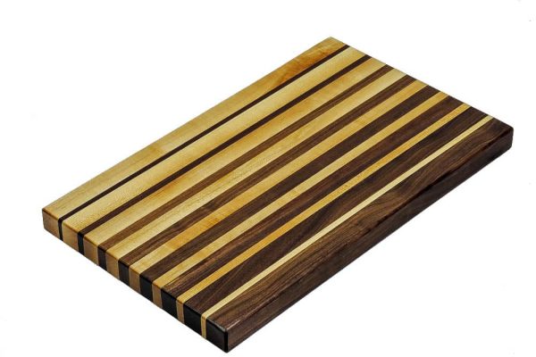 Maple and walnut edge grain cutting board featuring narrowing opposing strips running along the long edge of the cutting board. Canadian made by Bergeron Woodgrains