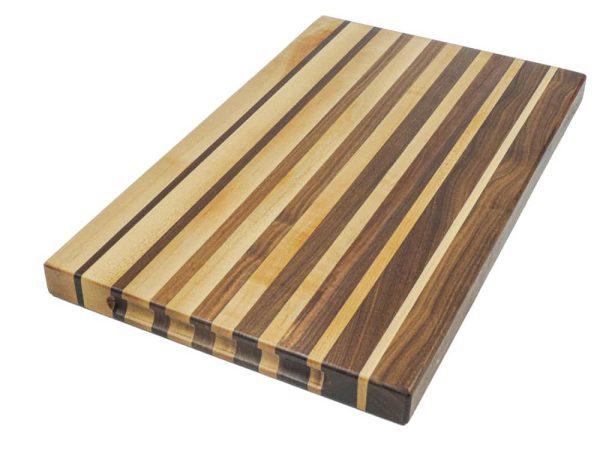 Maple and walnut edge grain cutting board featuring narrowing opposing strips running along the long edge of the cutting board and embedded grooved handles along the side of the board. Canadian made by Bergeron Woodgrains