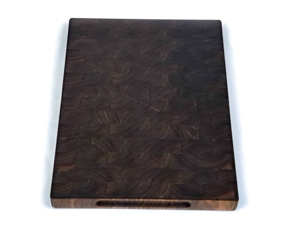 Handcrafted Walnut end grain cutting board featuring embedded grooved handles on he side of the cutting board. Made in Canada by Bergeron Woodgrains.