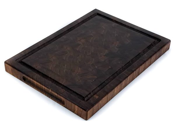 Handcrafted Walnut end grain cutting board featuring embedded grooved handles and juice groove on the side and top of the cutting board. Made in Canada by Bergeron Woodgrains.