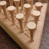 Wood triangle peg solitaire brain teaser featuring guidelines for legal moves, bevelled edges, wooden pegs and scoring instructions on the back. Made in Canada by Bergeron Woodgrains