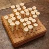 Wood square traditional peg solitaire brain teaser featuring guidelines for legal moves, bevelled edges, wooden pegs and scoring instructions on the back. Made in Canada by Bergeron Woodgrains