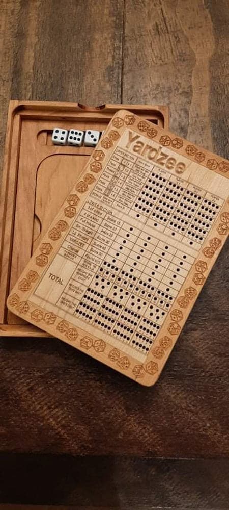 Handcrafted wooden board game featuring a Yarzee scorecard with storage box for accessories, similar to Yahtzee. Made by Bergeron Woodgrains.