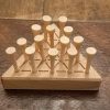 Wood triangle peg solitaire brain teaser featuring guidelines for legal moves, bevelled edges, wooden pegs and scoring instructions on the back. Made in Canada by Bergeron Woodgrains