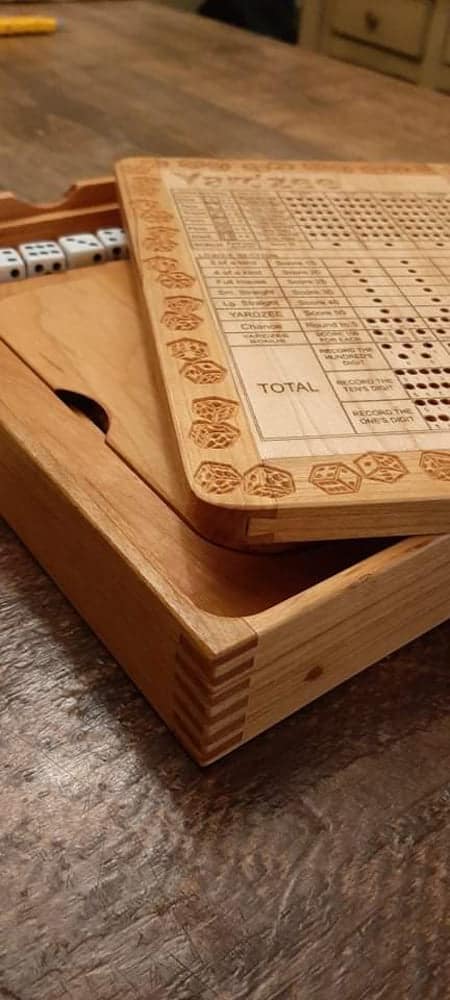 Elegant handcrafted wooden board game featuring a Yardzee scorecard with storage for accessories by Bergeron Woodgrains. Features dovetail & boxed finger joints. Similar to Yahtzee