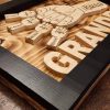 Handcrafted wooden home decor sign made by Bergeron Woodgrains. Black painted frame with natural wood name label such as Grandpa with matching big fist bump surrounded by smaller fist bumps with matching children’s names all on a flame torched wood background.