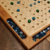 Handcrafted wood sequence board game featuring a cherry border with game piece cutouts and laser engraved baltic birch centre and walnut miter keys on each corner. Canadian made by Bergeron Bergeron